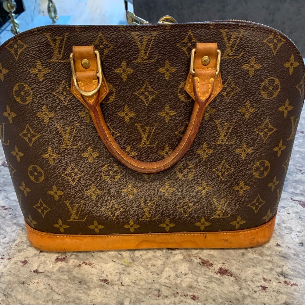 Used authentic Louis Vuitton Alma Hand Bag